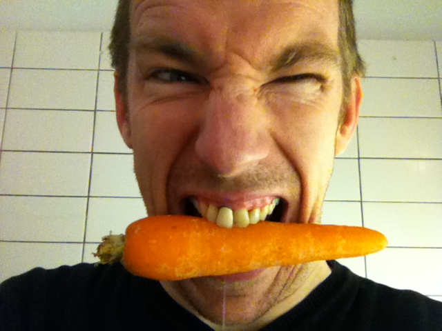 Man bits carrot